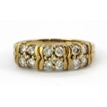 A 9ct yellow gold ring set with two rows of brilliant cut diamonds, (P.5).