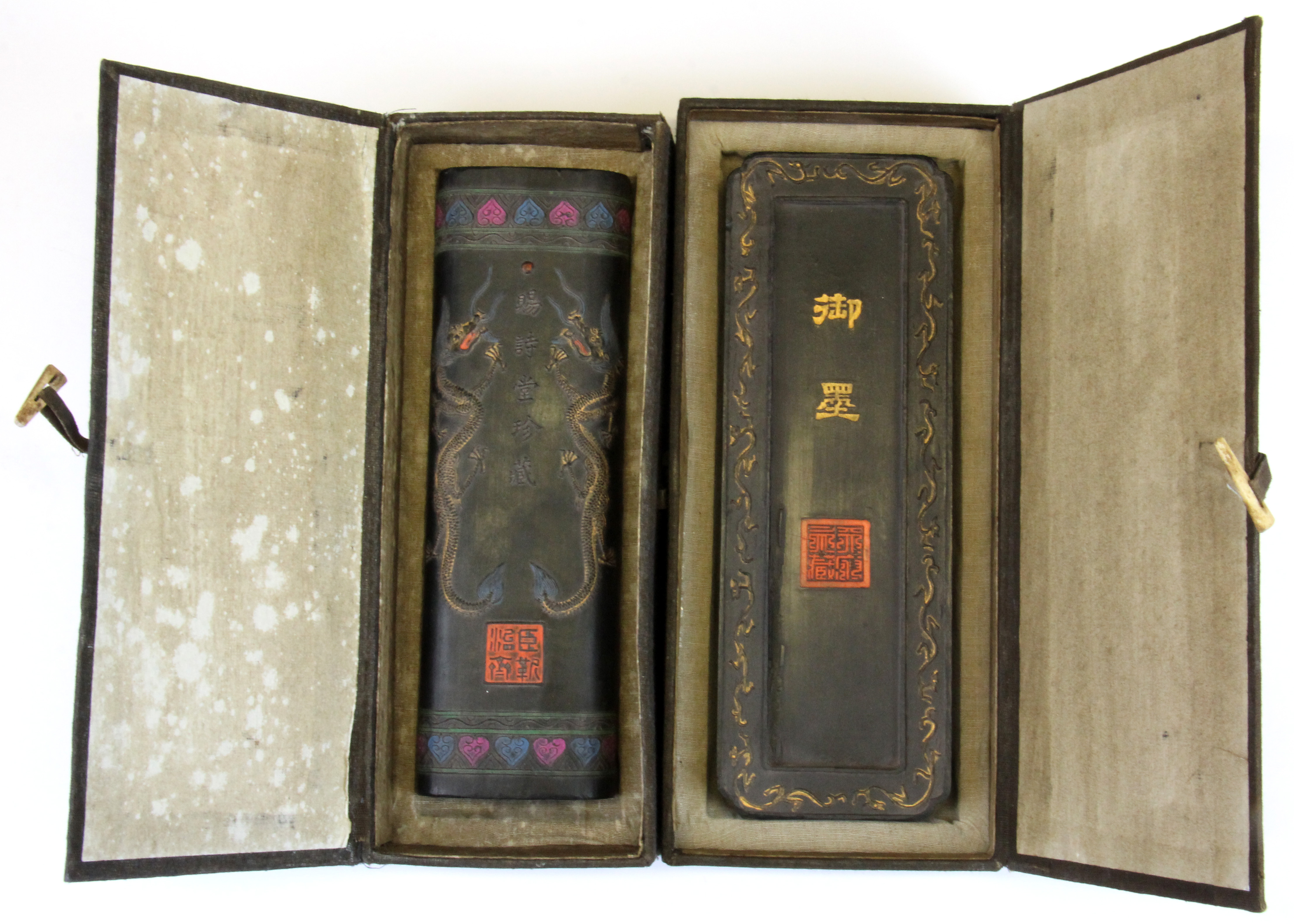 Two Chinese boxed hand decorated calligraphy ink blocks, longest L. 23cm.