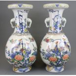 A pair of early - mid 20th Century Chinese hand painted porcelain vases with elephant head