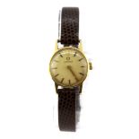 A boxed lady's 18ct yellow gold Omega wrist watch.