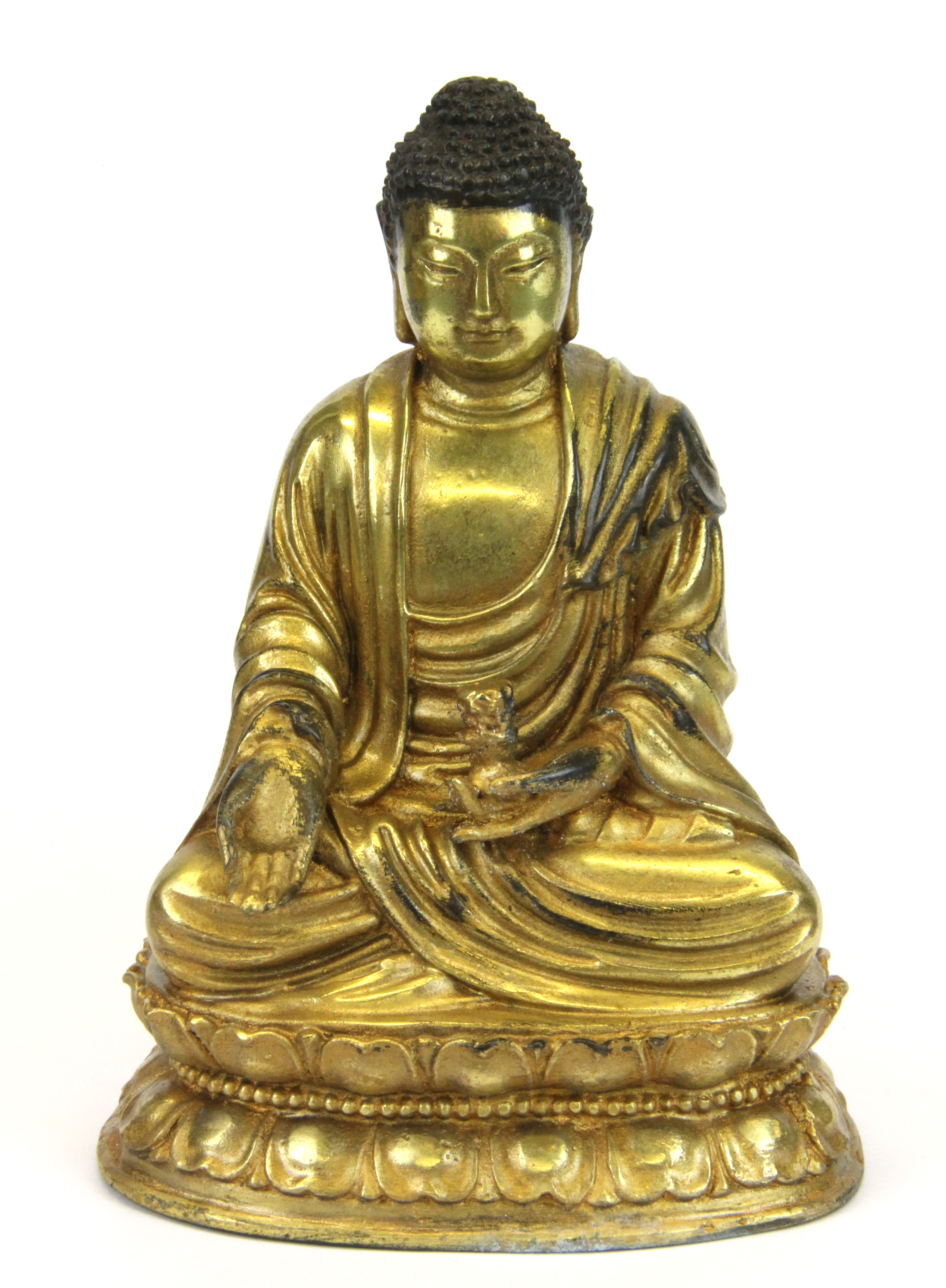 A Sino-Tibetan gilt bronze figure of the seated Buddha, H. 17cm.