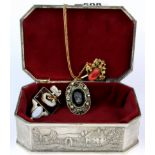 A silverplated box containing a silver, agate and opal pendant and two other items.