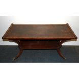 A vintage leather topped pedestal coffee table, size 104 x 49 x 48cm.