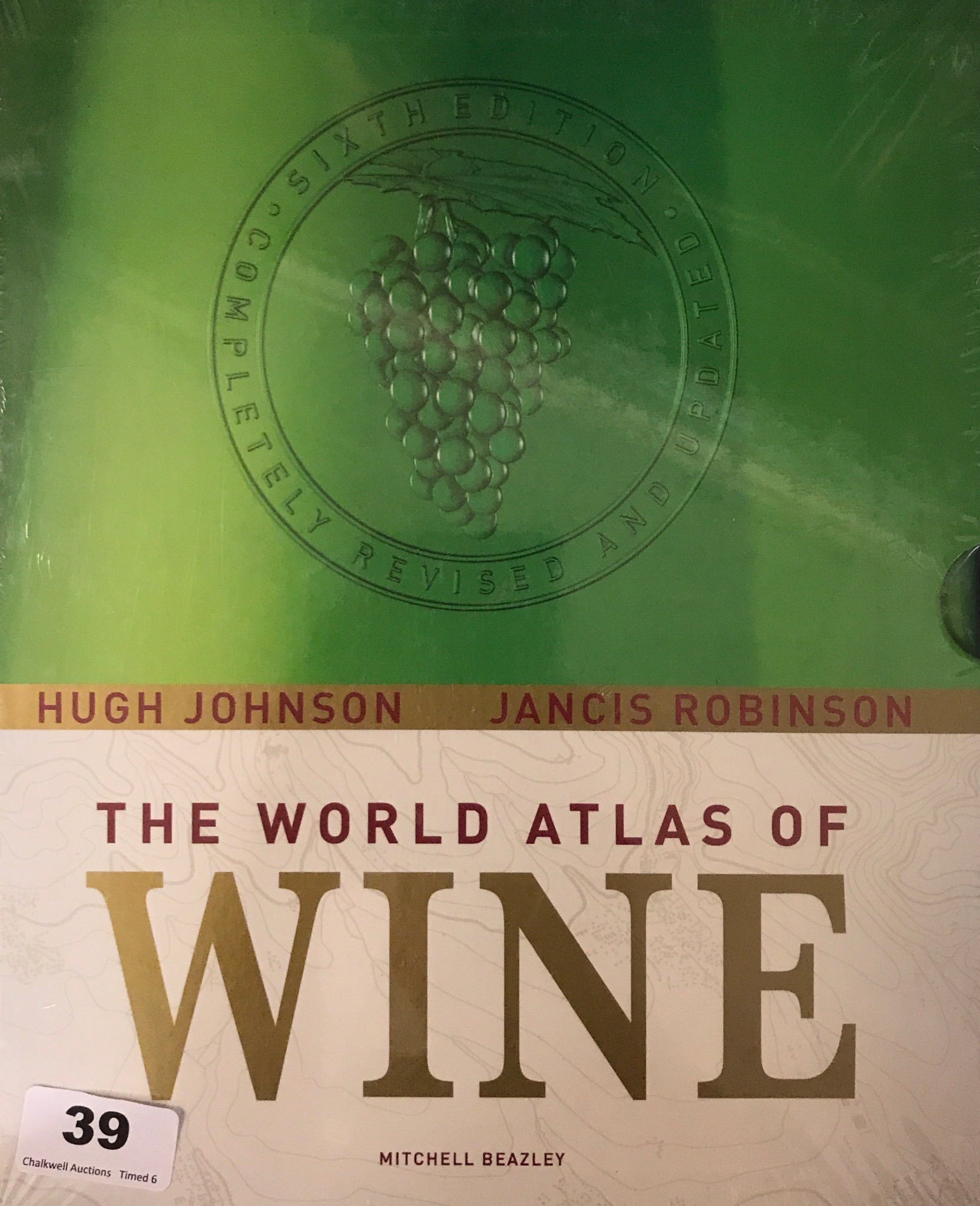 A copy of 'The World Atlas of Wine' by Hugh Johnson & Jancis Robinson.