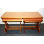 A nest of three 1970's beechwood coffee tables, size 101 x 51 x 42cm.