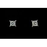 A pair of 18ct white gold (stamped 750) stud earrings set with princess cut diamonds, approx. 0.66ct