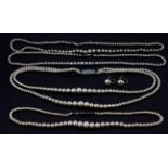 Four graduated pearl necklaces (two with 9ct gold clasps and 2 with silver clasps, and a pair of
