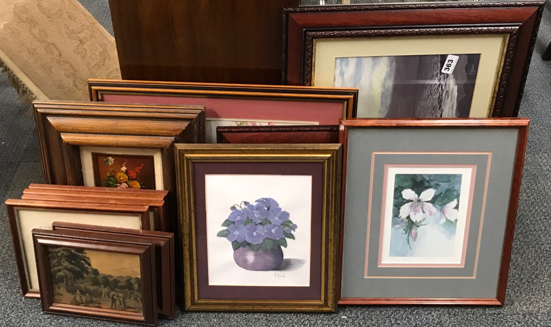 A quantity of framed prints.