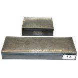 Two 1920's silver inlaid metal boxes, longest L. 23cm.