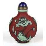An unusual Chinese three colour carved Peking cameo glass snuff bottle with hardstone stopper, H.