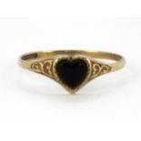 A 9ct yellow gold onyx set ring, (O.5).