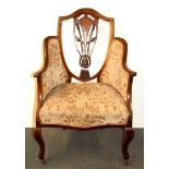 An Edwardian inlaid mahogany armchair.
