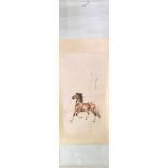 A Chinese silk mounted scroll painting of a horse, size 64 x 210cm.