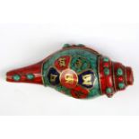 A Tibetan mosaic decorated conch shell trumpet with brass inlaid mantra, L. 15cm.