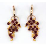 A pair of 925 silver rose gold gilt drop earrings set with round cut rubies and fancy yellow