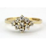 A 9ct yellow gold stone set cluster ring, (N).