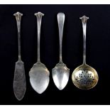 Four hallmarked silver cutlery items.