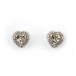 A pair of 18ct white gold heart shaped stud earrings set with brilliant cut diamonds, approx. 0.60ct