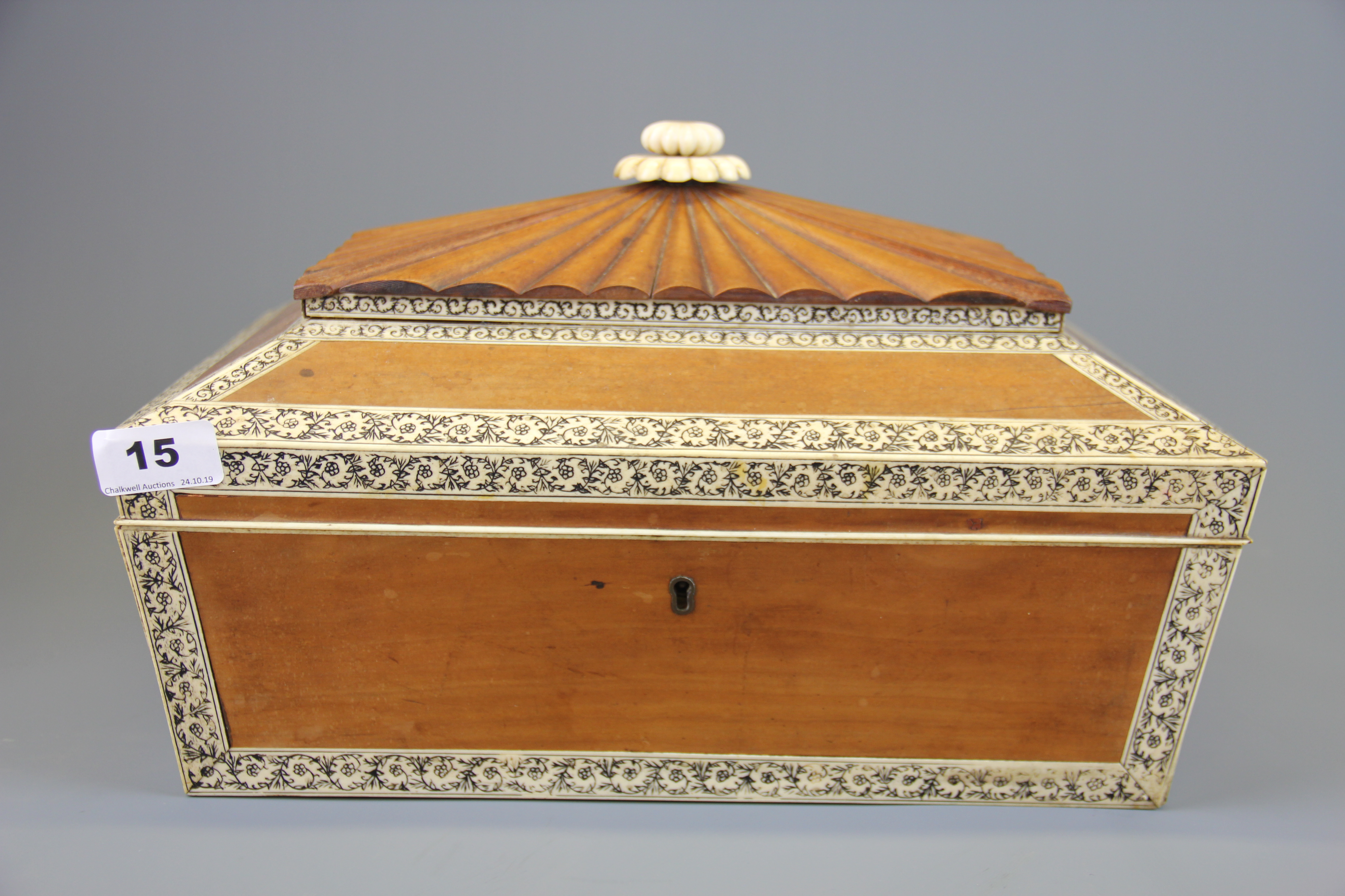 An early 19th century carved sandalwood and ivory decorated casket, size 36 x 27 x 23cm.