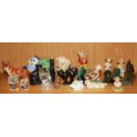 A collection of ceramic, glass and other animal figures.