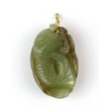 A small antique Chinese carved nephrite jade amulet of a fan tailed fish, H. 3cm.