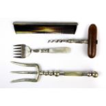 A silver backed comb with a silver plated bread fork, cake fork and cork screw.