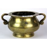 An early 20th century Chinese polished bronze censer, W. 18cm H. 9cm.