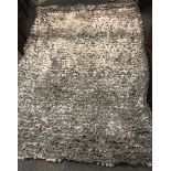 A good quality contemporary rug, W. 67cm.