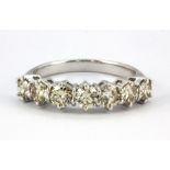 An 18ct white gold (stamped 750) ring set with seven brilliant cut diamonds, approx. 1.37ct, (N.5).