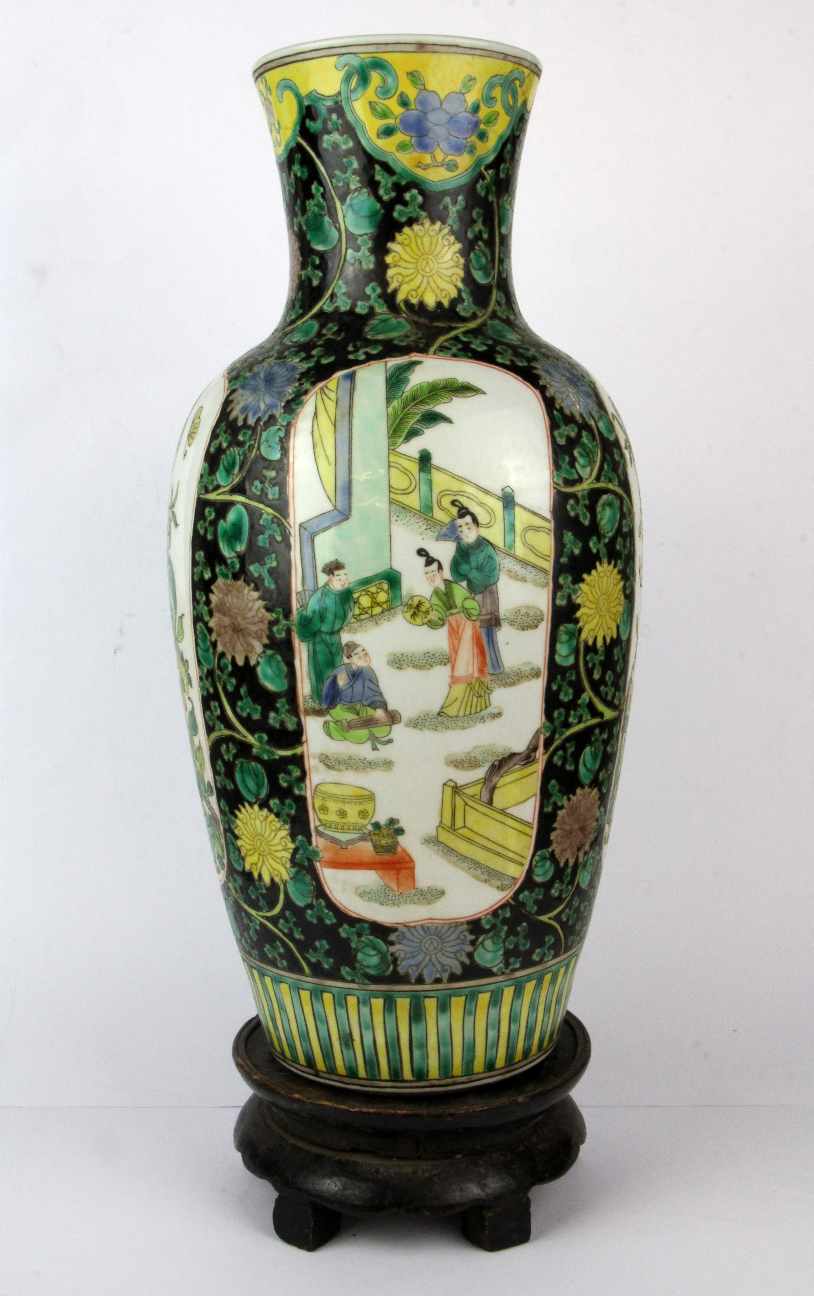 A Chinese 19th/ early 20th Century famille noire decorated porcelain vase and carved wooden stand, - Image 2 of 3