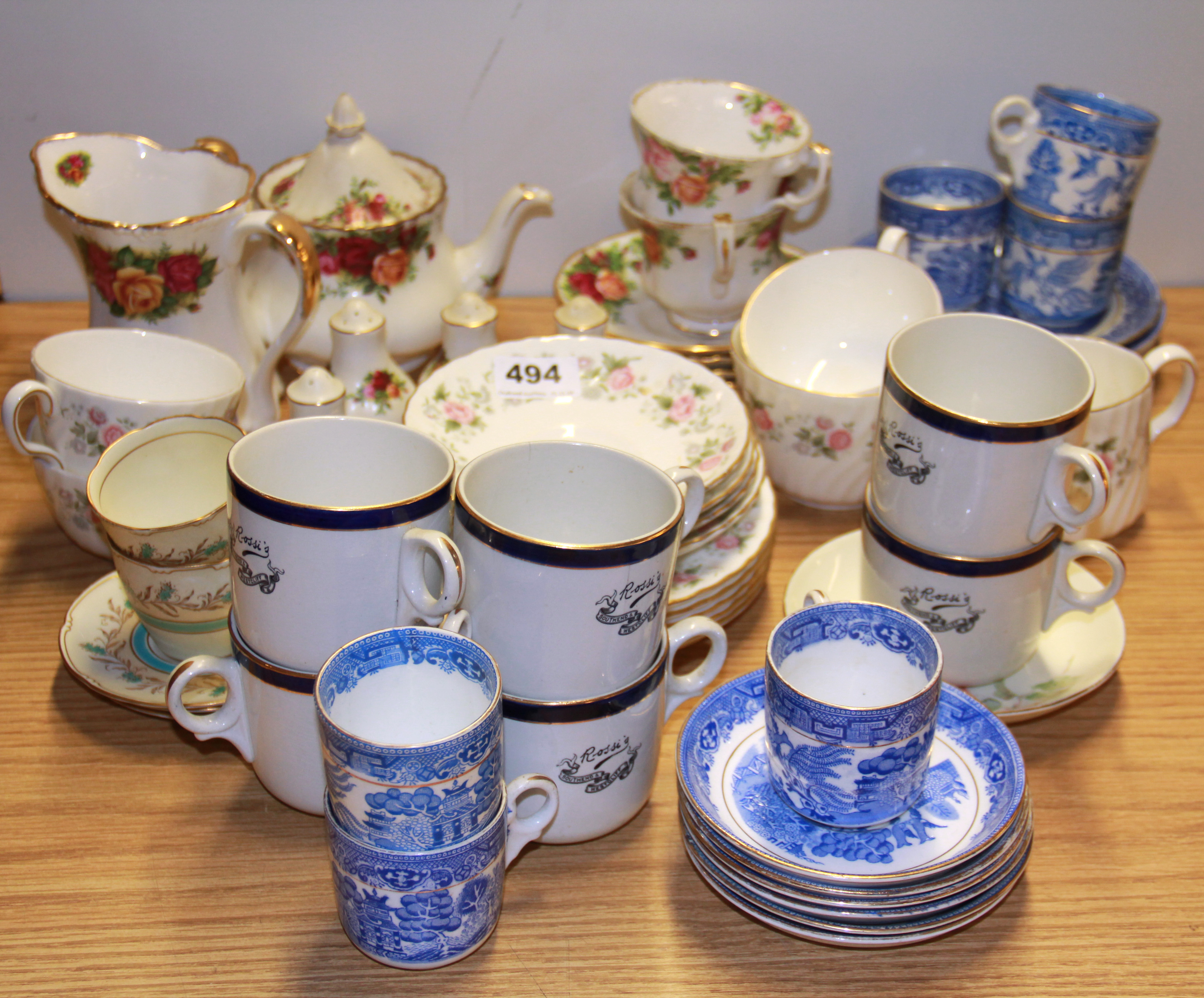 A Royal Albert 'old country roses' teapot and two cups and saucers together with further china, a