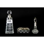 Two hallmarked silver topped perfume bottles and a silver topped box, tallest 15cm.