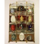 A display shelf with a collection of ornamental eggs, various materials, size 40 x 27cm.