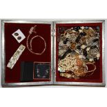 A box of mixed costume jewellery.