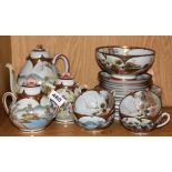 A Japanese hand painted porcelain part tea set.