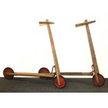 Two vintage wooden scooters.