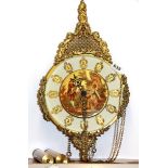 A gilt wall clock.