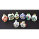 Eight Chinese hand painted porcelain snuff bottles, tallest H. 6.5cm.