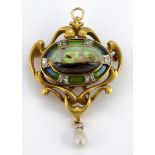 An Art Nouveau yellow metal (tested 18ct gold) enamelled brooch / pendant set with a boulder opal,