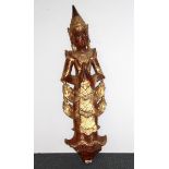 A Siamese carved wooden figure of an angel with gilt decoration, H. 95cm.