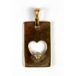 A 10ct yellow gold (stamped 10k) diamond set heart pendant, L.1.4cm.