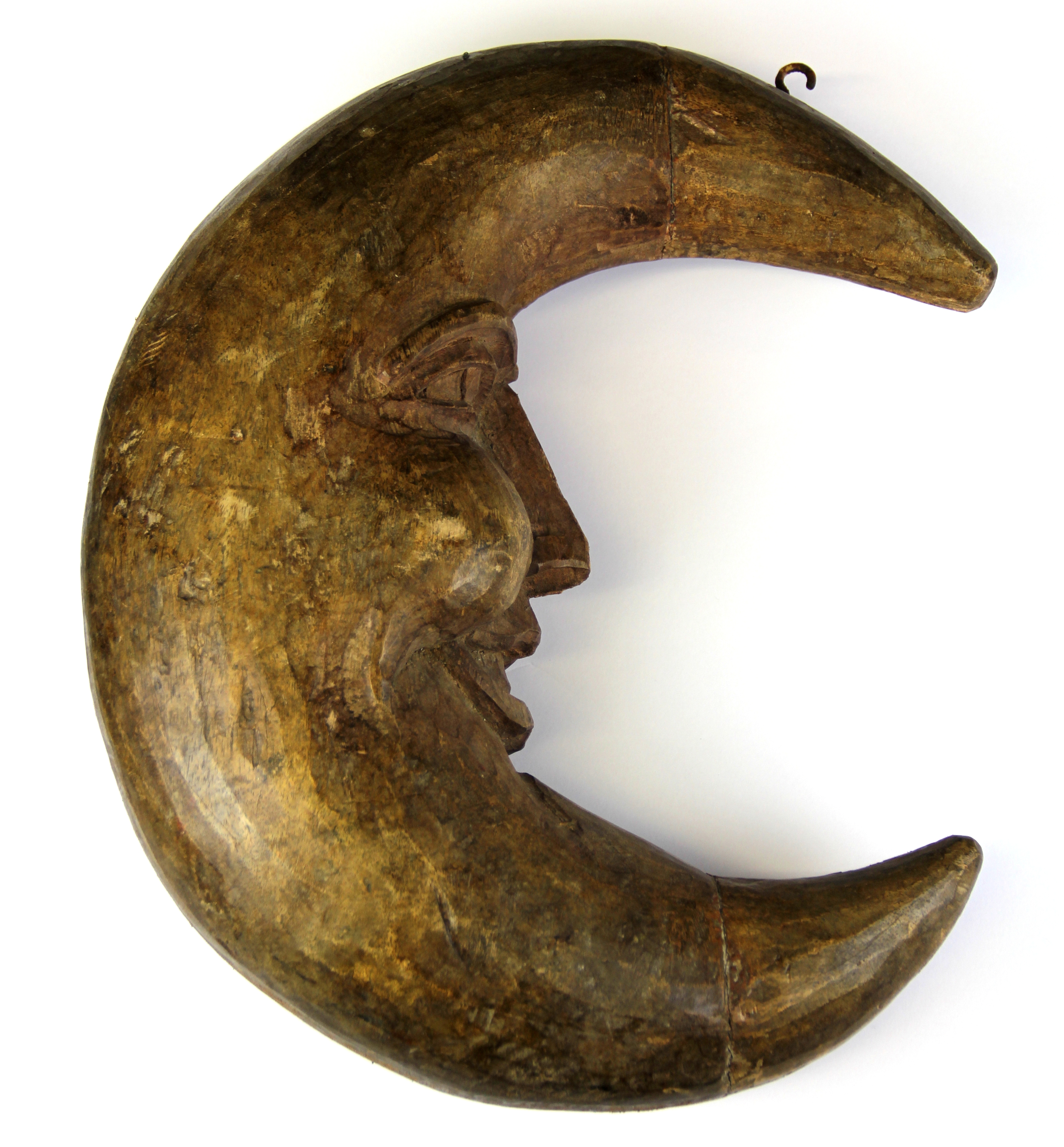 A late 19th Century carved wooden hanging moon figure, size 40 x 32cm.