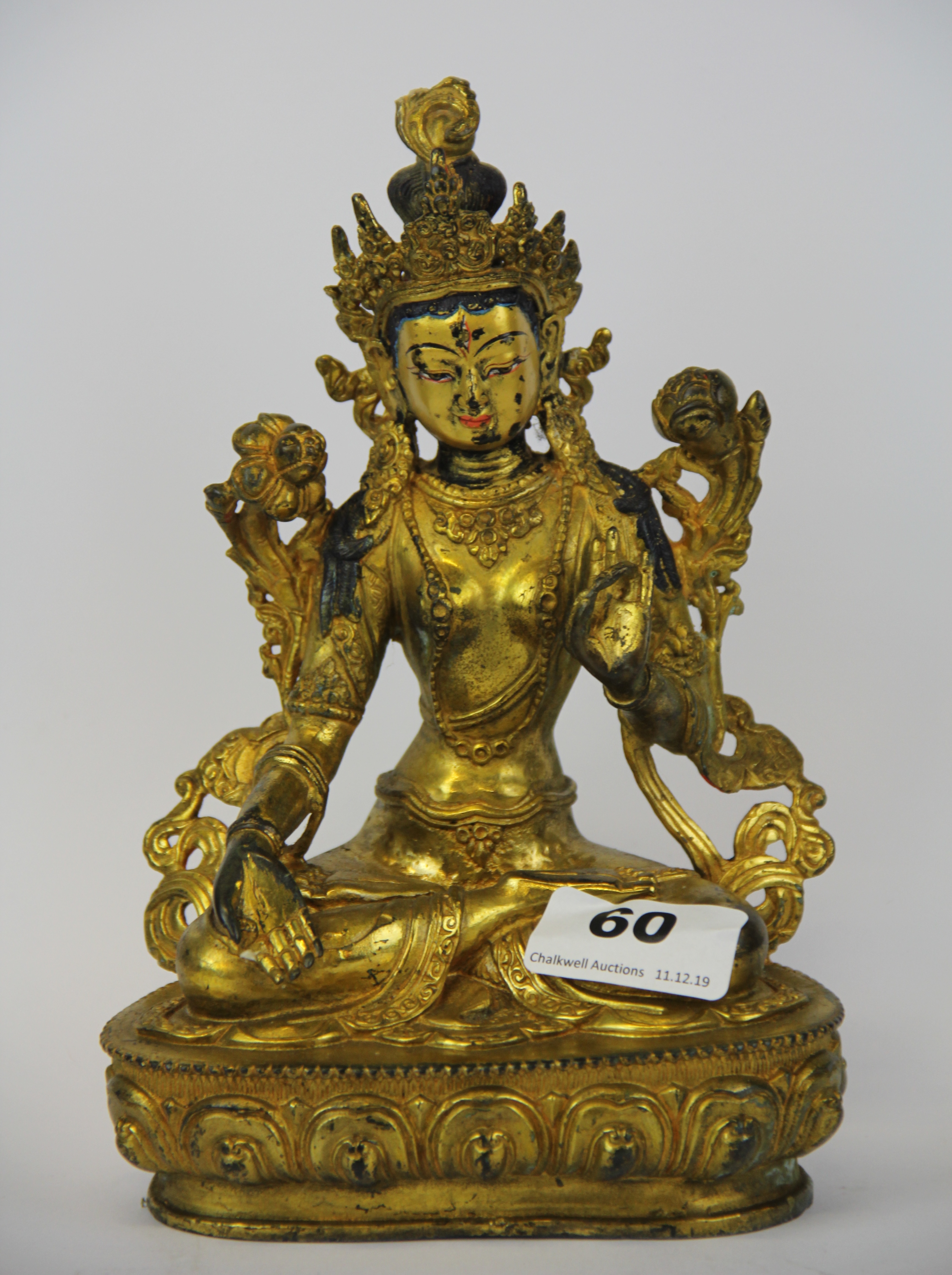 A Tibetan gilt bronze figure of the seated Tara, H. 22cm.