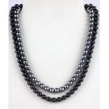 A black pearl necklace on a silver clasp together with a dark grey pearl necklace, L. 46 & 40cm.