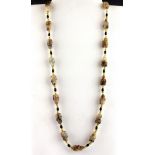 A Chinese bead necklace with carved agate Happy Buddhas, folded L. 35cm.