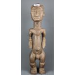 An African Chokwe carved wooden figure, H. 50cm.