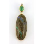 An 18ct yellow gold pendant set with a cabochon cut emerald, a cabochon cut opal boulder and