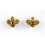 A pair of 9ct gold citrine set stud earrings, L. 1.3cm.