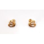 A boxed pair of 9ct yellow gold stud earrings. L. 1cm