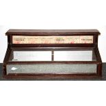 An Edwardian counter top cigarette display cabinet, W. 61cm H. 25cm.